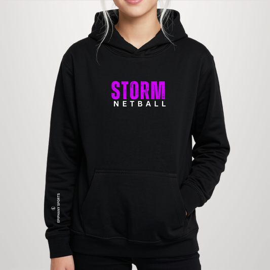 A person wearing a black pullover hoodie with a bright pink and white 'STORM NETBALL' graphic on the chest, and a small white 'EPPMAH SPORTS' logo on the left sleeve, against a light gray studio background.