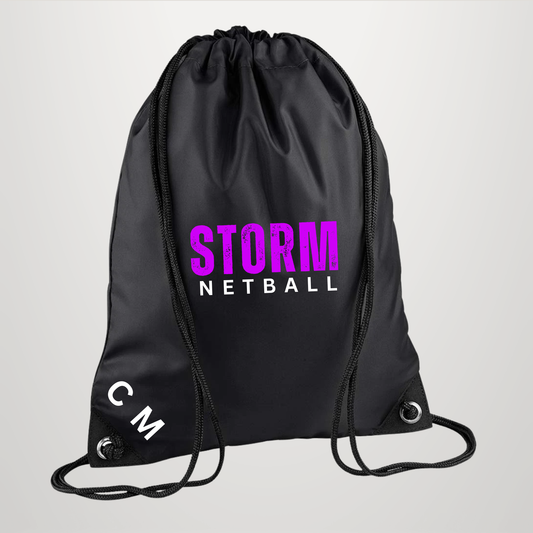 A black drawstring gym bag with 'STORM NETBALL' printed on the front in purple and white, and 'CM' printed in white near the bottom left corner, shown against a light gray background.