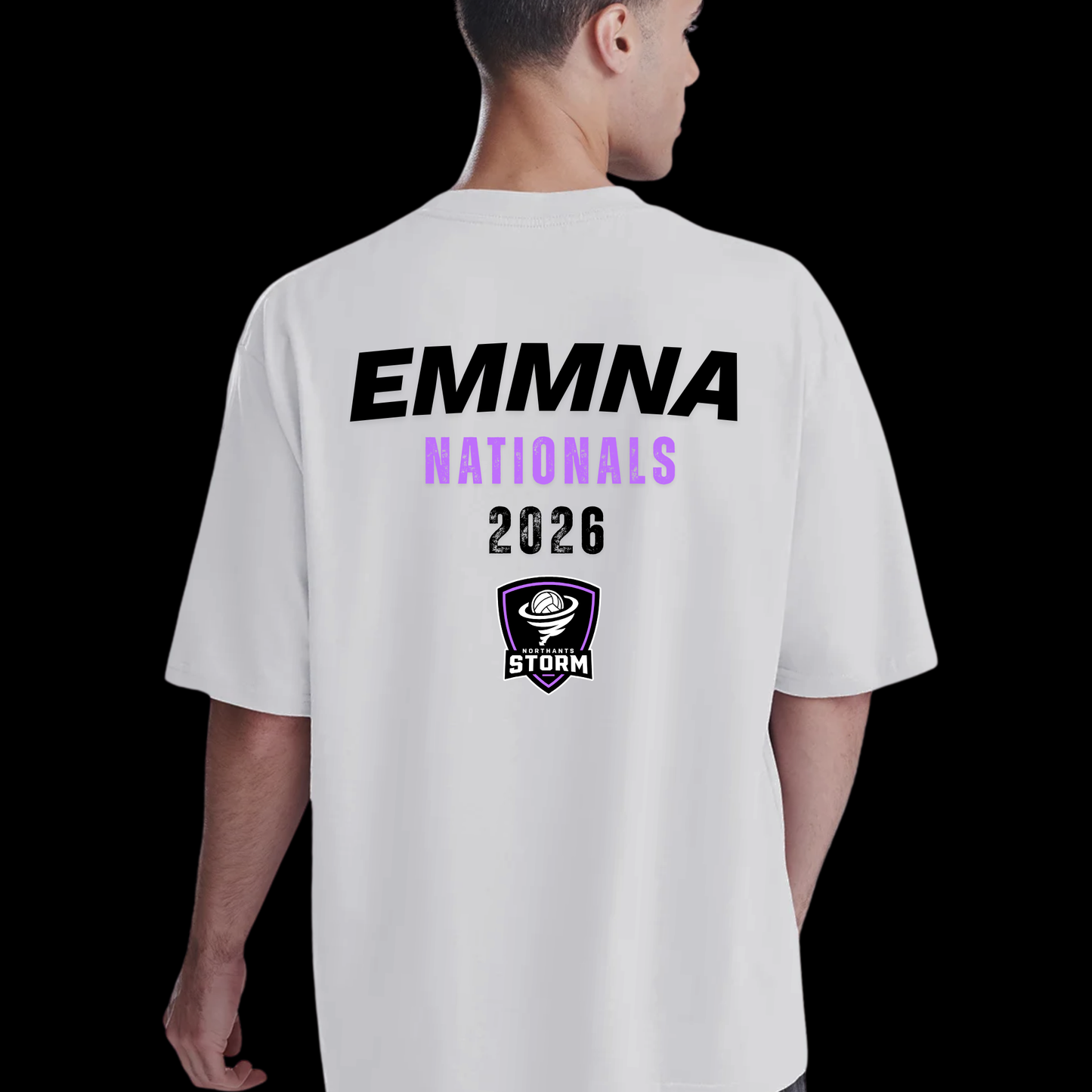 A man viewed from the back wearing a white short-sleeve T-shirt with a large graphic print on the back. The print reads 'EMMNA NATIONALS 2026' in black and light purple text, with a Storm logo below, against a solid black background.