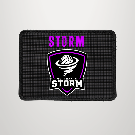 A rectangular black textured patch featuring the word 'STORM' in bright purple above a shield logo with a volleyball and the text 'NORTHANTS STORM' in white and purple.